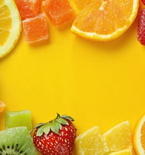 An engaging visual of freeze-dried candy mixed with fresh fruits, highlighting healthy snacking options for children.